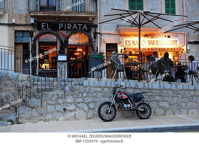 Evening mood with bar cafe restaurant terrace at the marina, the houses of Puerto Soller at back, Port de Soller, Mallorca, Majorca, Balearic Islands