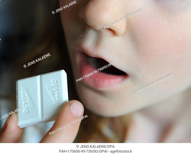 FILEÂ - A file picture dated 26 April 2011 shows a girl bringing a piece of Dextro Energy to her mouth, in Berlin, Germany