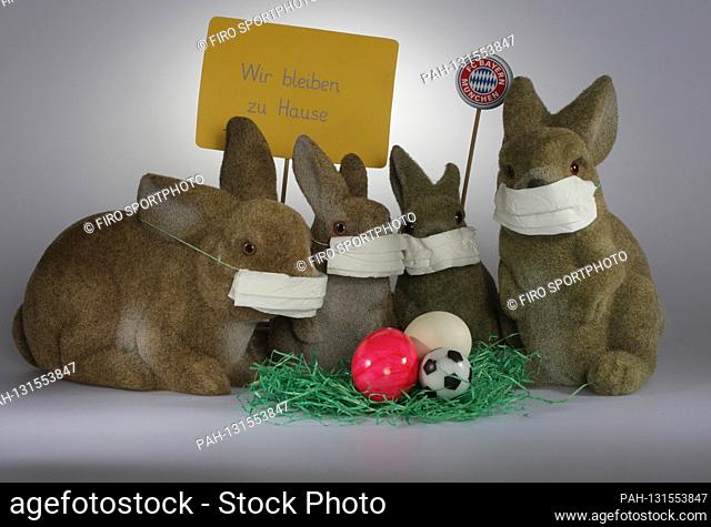 firo: 06.04.2020 Easter 2020, Easter bunnies with face mask and Bayern Mvºnchen, Muenchen, logo Fuvuball is canceled and all fans have to stay at home Easter...
