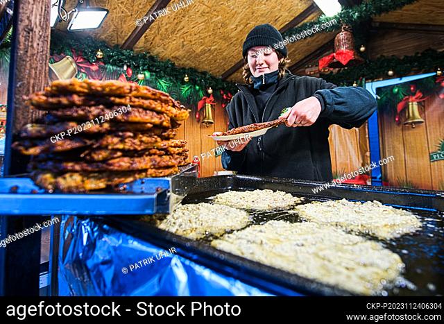 Christmas tree lighting ceremony was held in Brno, Czech Republic, on November 24, 2023. Pictured is a potato pancake vendor. (CTK Photo/Patrik Uhlir)