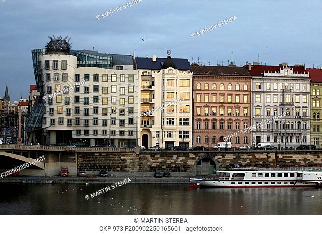 A steam boat is going on the river Vltava under the Dancing House in Prague, Feb 25, 2009 CTK Photo/Martin Sterba