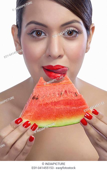 Portrait of a woman eating a watermelon