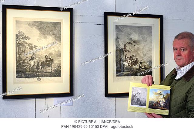 29 April 2019, Saxony-Anhalt, Wörlitz: The art collector Uwe Quilitzsch hangs in the historic inn ""Eichenkranz"" for an exhibition of copper engravings with...