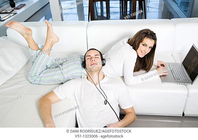 Young couple enjoying leisure at home