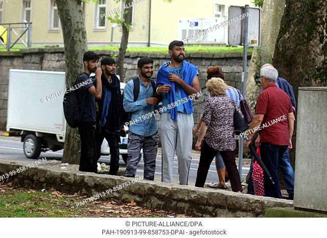 09 September 2019, Bosnia and Herzegovina, Bihac: Migrants are in the centre of the city. The small town of Bihac on the border with Croatia feels overwhelmed...