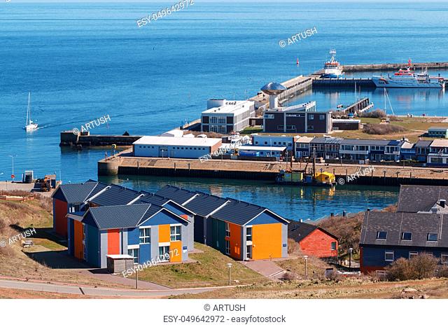 harbor in Island Helgoland, Germany, nordic style houses with boat and blue sky, panorama view from hill to north sea