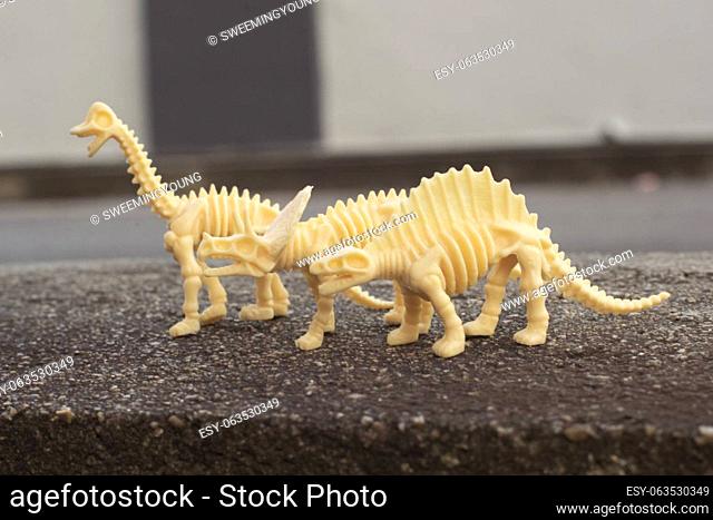 infrared image of the dinosaur toys on the asphalt street
