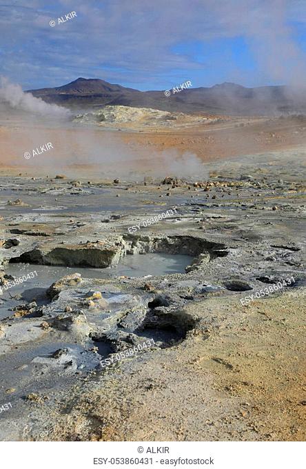 Fumaroles with volcanic boiling mud pots surrounded by sulfur hot springs in Hverir Namafjall geothermal place in Iceland