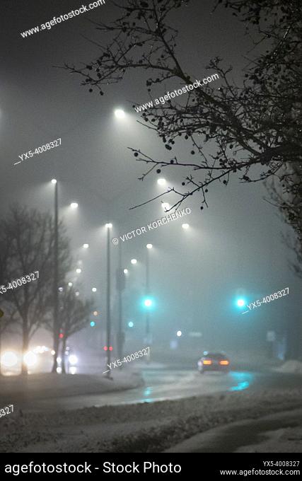 Foggy night on a suburban street in winter