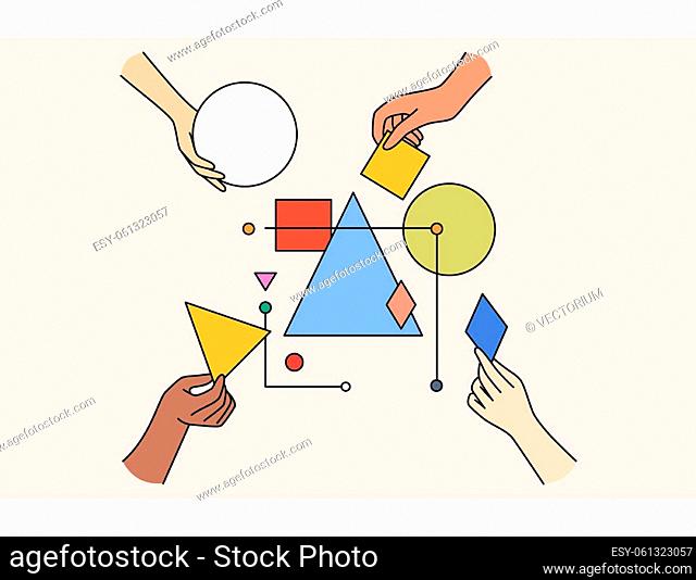 Multiethnic work team connect geometrical shapes and figures involved in teambuilding activity. Hands building system together