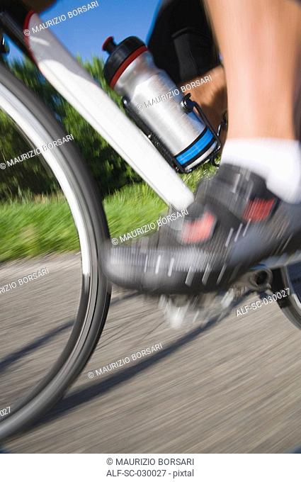 Blurred motion of a cyclist pedaling
