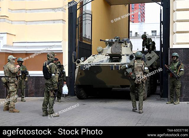 RUSSIA, ROSTOV-ON-DON - JUNE 24, 2023: PMC Wagner fighters and an armoured vehicle are seen in Budyonnovsky Prospekt Street. Erik Romanenko/TASS