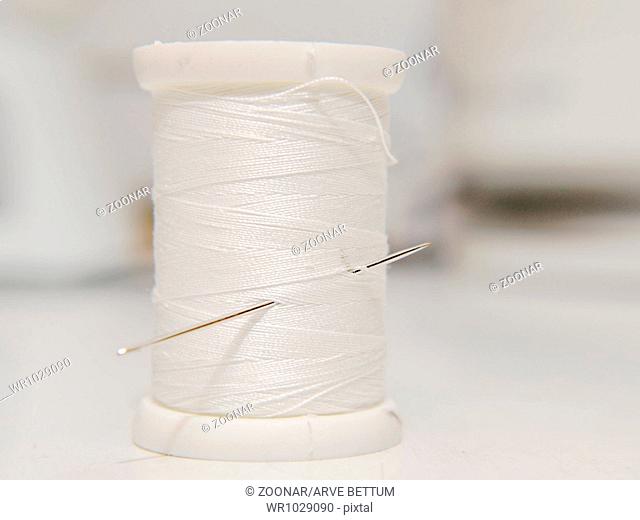 White thread on spool