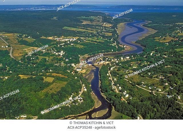 Water levels of Bear River, draining into Annapolis Basin & Bay of Fundy, rise and fall daily with Fundy tide. Nova Scotia, Canada