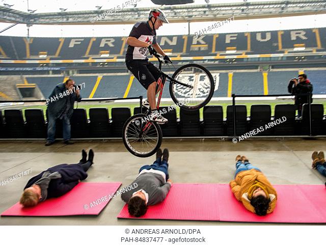 Trial biker Max Schrom has set a new world record with 37 rear wheel jumps over several persons laying on the ground in Frankfurt, Germany, 17 October 2016