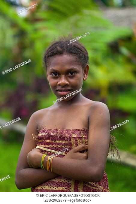 Smiling ni-vanuatu girl in traditional clothing, Sanma Province, Espiritu Santo, Vanuatu