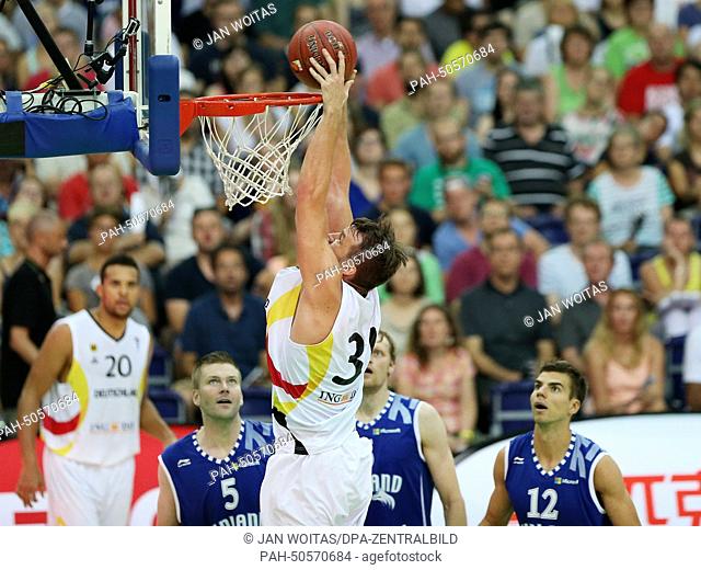 Germany's Danilo Barthel dunks during basketball match between Germany and Finland in the Arena Leipzig, in Leipzig, Germany, 27 July 2014