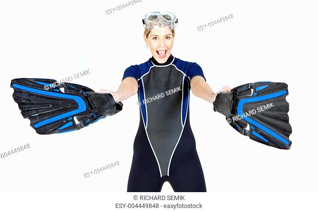 portrait of woman wearing neoprene with flippers and diving goggles
