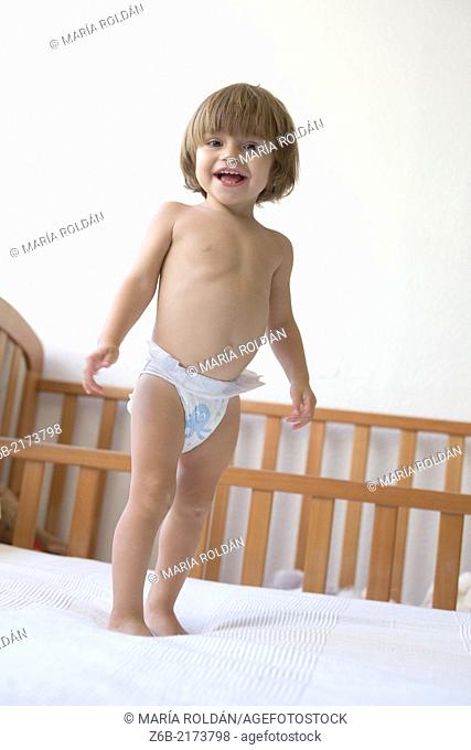 Baby girl, 22 months, Toddler, smiling, Nappy, Diaper, Bedroom, Bed Linen, cot