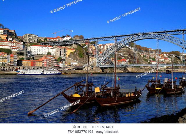 Traditional rabelo boats, Porto city skyline, Douro river and and Dom Luis or Luiz iron bridge. Porto, PÜortugal, Europe