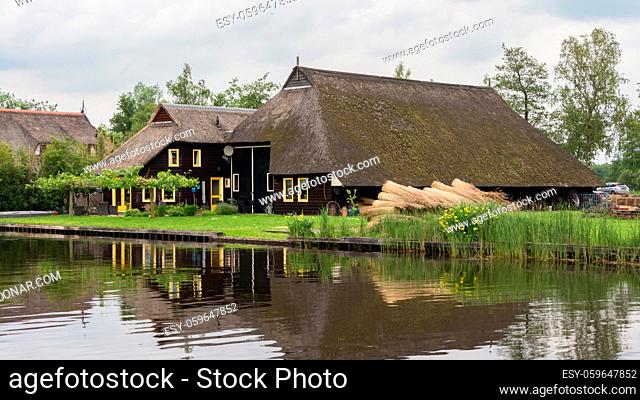 Beautiful traditional wooden thatched farm in the beatiful little village Blokzijl in the Netherlands
