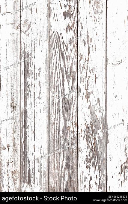 Aged white wooden background texture. Wood paneling with cracked an peeled paint