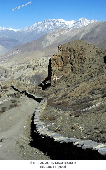 Stone wall winds at the path to Jharkot Mustang Annapurna Region Nepal