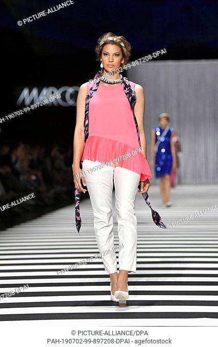 02 July 2019, Berlin: The model Kenya Kinski Jones walks down the catwalk at the show of designer Marc Cain in the Velodrom
