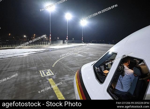 06 December 2023, Berlin: View of the tarmac at BER Airport with a government plane in the foreground. The Foreign Minister visits the capital Ljubljana to hold...