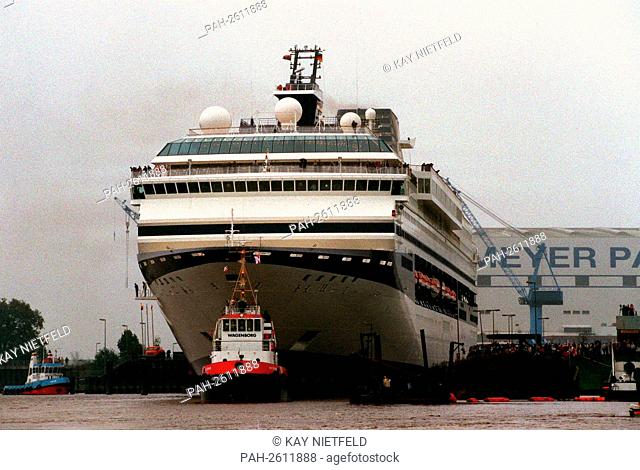 The 249 m long and 32 m wide cruise ship ""Century"" (70000 GRT) leaves on the Ems the Meyer shipyard in Papenburg to Uberfuhrung after Leer and in the aftert...