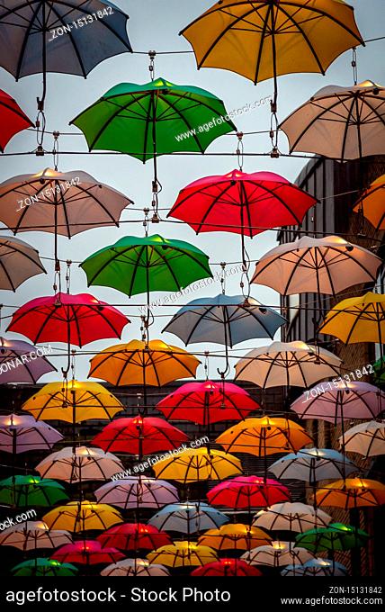 Colorful umbrellas over the city street in Dublin. Concept of joyful mood