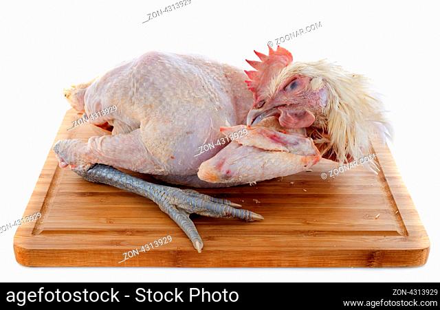 Bresse chicken on a cutting board in front of white background