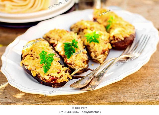 Meat and Tomato Stuffed Eggplant Halves with Cheese Crust, copy space for your text