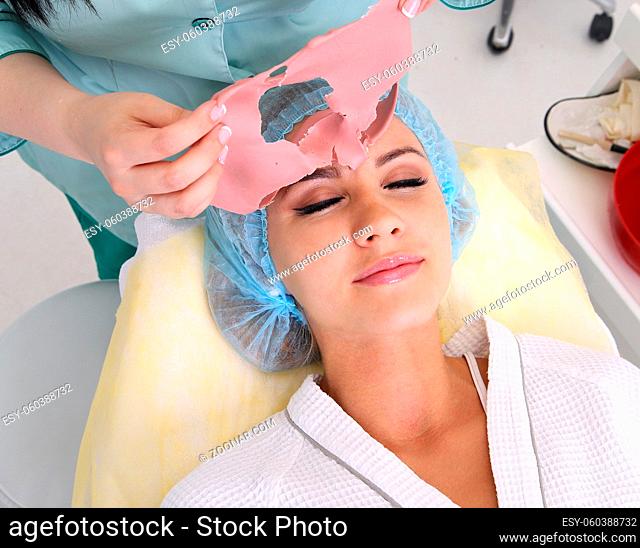 Beauty skin care cosmetics and health concept. Closeup young woman face, girl removing facial peel. Peeling