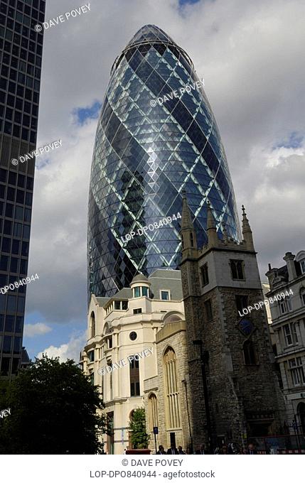 30 St Mary Axe, also known as The Gherkin, overlooking St Andrew Undershaft church which has survived both the Great Fire of London in 1666 and the bombs of the...