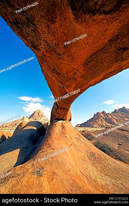 View from below with the fisheye of -The Arch- famous rock arch near the Spitzkoppe in Namibia, which has been used as a backdrop in several films