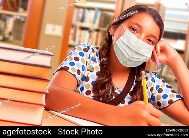 Hispanic Girl Student Wearing Face Mask Studying in Library