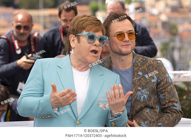 Elton John (l) and Taron Egerton pose at the photocall of 'Rocketman' during the 72nd Cannes Film Festival at Palais des Festivals in Cannes, France