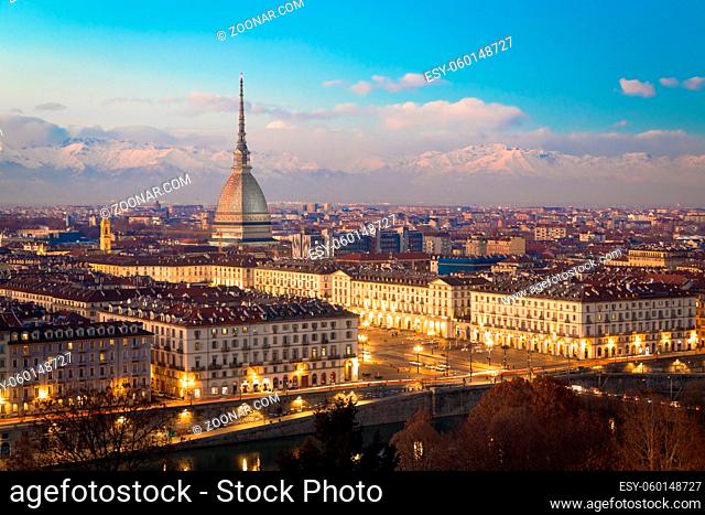 Turin, Piedmont Region, Italy. Panorama from Monte dei Cappuccini (Cappuccini's Hill) at sunset with Alps mountains and Mole Antonelliana monument