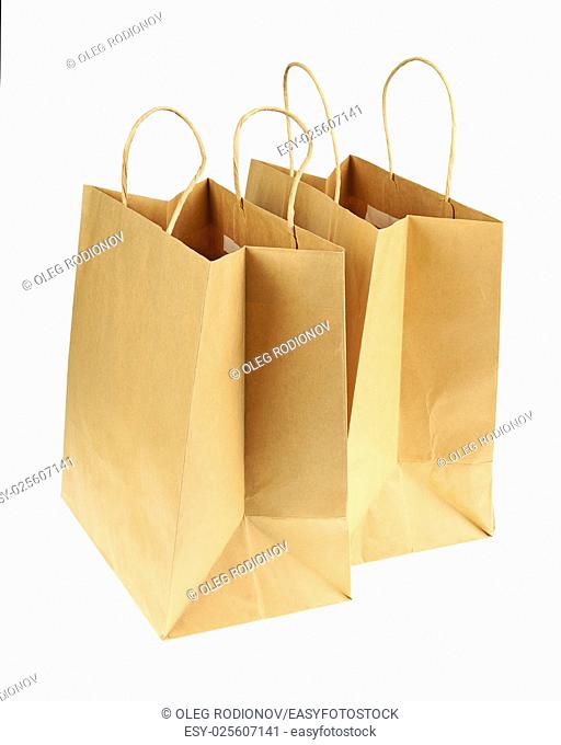 Empty brown recycled paper shopping bags isolated on white background. Side view from top