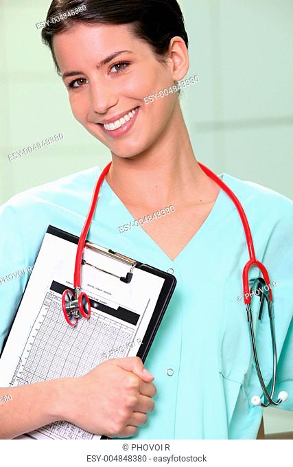 Brunette nurse with clip-board