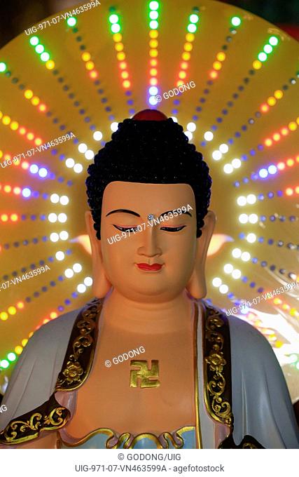 Chua Vinh Nghiem buddhist pagoda. Buddha statue with neon light