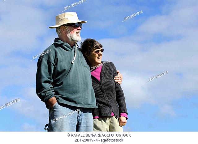 An old couple are smiling and happy