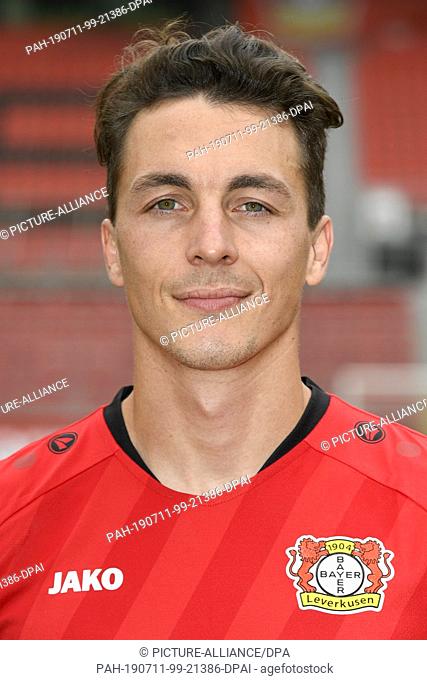 11 July 2019, North Rhine-Westphalia, Leverkusen: The Leverkusen midfielder Julian Baumgartlinger poses for a photo during the presentation of the Bayer...