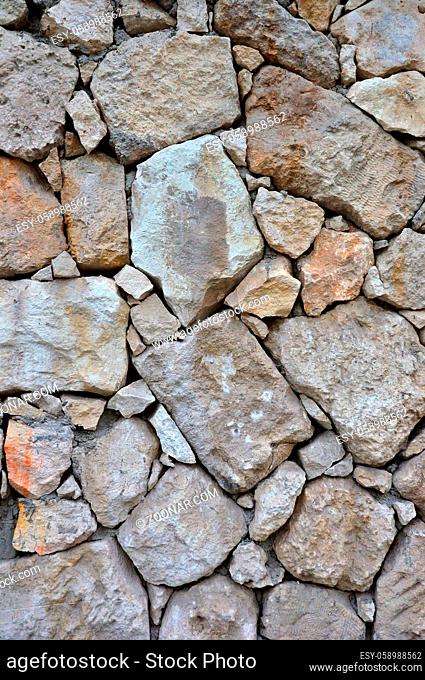 Weathered antique old cracked stone blocks wall retro background