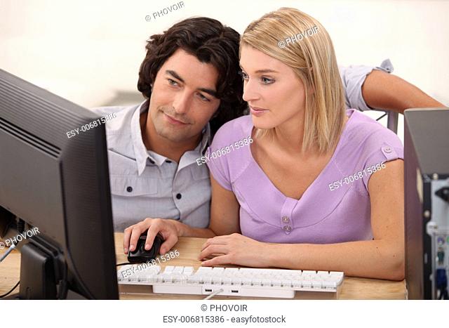 Couple looking at a computer together
