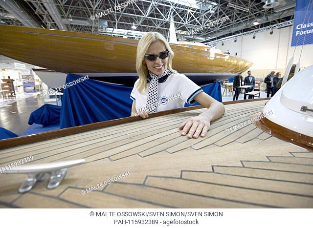 Boat model Jana in front of a historic wooden sailboat in the Classic Forum, at the Boot 2019, Booth 2019 in Duesseldorf from 19 to 27 January 2019, 18