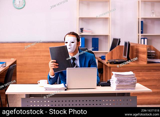 Young employee wearing masks in the office