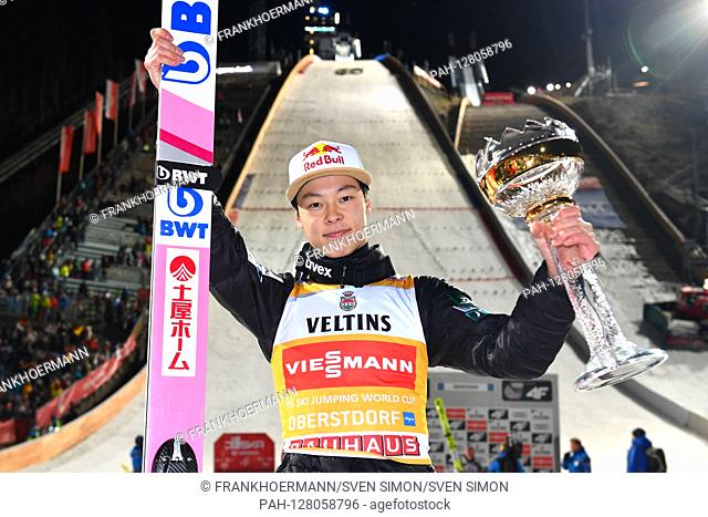 Ryoyu KOBAYASHI (JPN), jubilation, joy, enthusiasm about 1st place, winner, winner, , posing with trophy, trophy in front of the hill, action, single image