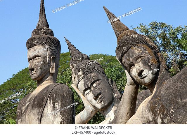 Three Buddhistic sculptures in Xieng Khuan Buddha Park in Vientiane, capital of Laos, Asia